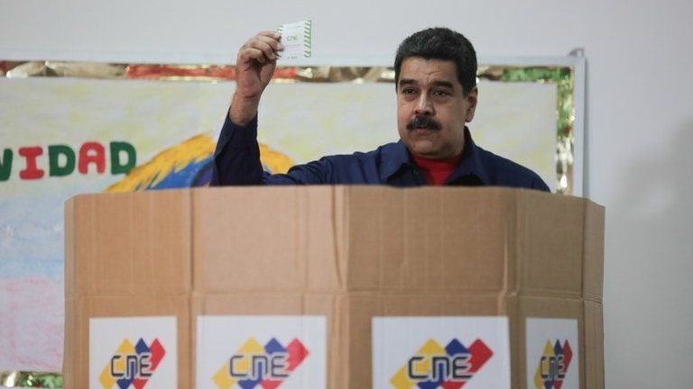 A handout photo made available by Miraflores shows Venezuelan President Nicolas Maduro, as he casts his vote, during the municipal elections in Caracas, Venezuela, 10 December 2017.