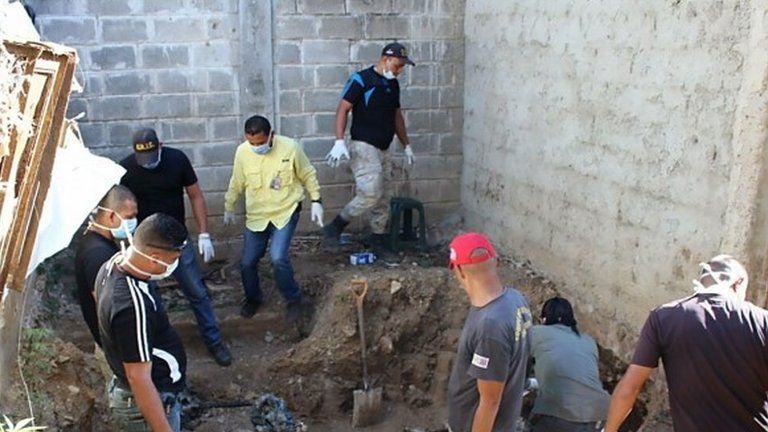 Forensic personnel study the remains of bodies discovered in the General Penitentiary of Venezuela, which has been closed down, in San Juan de los Morros, Guarico state, on March 10, 2017