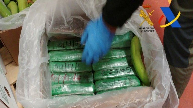 Spanish police display packages of cocaine which were seized in a shipment of bananas from Colombia in a container in the port of Algeciras.