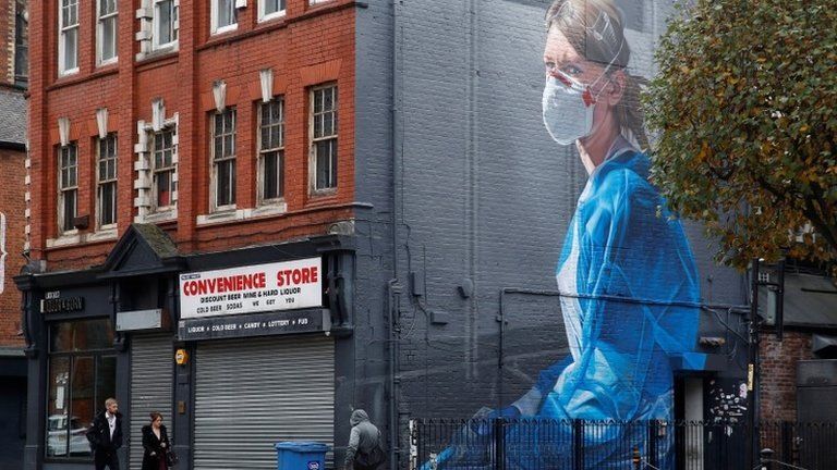 Mural of masked woman in Manchester