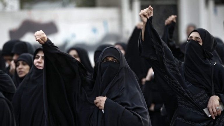 Women shout slogans during a demonstration in Bahrain