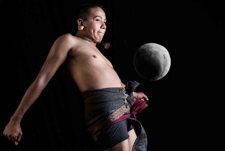 Ricardo Campos, a player of the pre-Columbian ballgame Ulama, hits a solid rubber ball with his hip