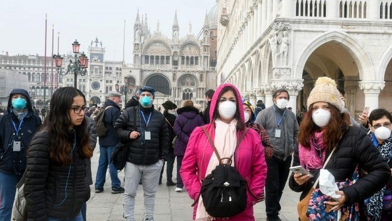 People wear masks in Venice, Italy. Photo: 25 February 2020