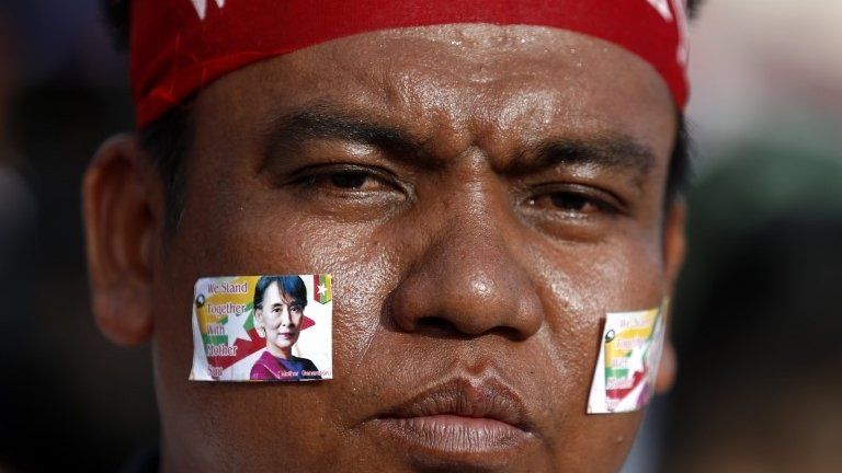 A Supporter wears the image of Myanmar State Counselor Aung San Suu Kyi on his cheek during a rally to show the support for Aung San Suu Kyi in front of City Hall in Yangon, Myanmar, 24 September 2017.