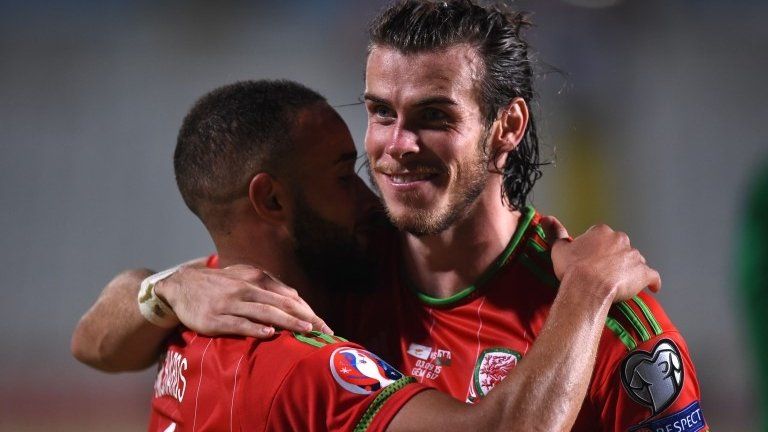 Gareth Bale (right) and Ashley Richards celebrate after the Welsh win against Cyprus