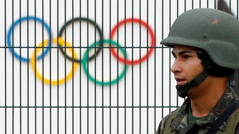 Brazilian soldier by the security fence outside the 2016 Rio Olympics Park in Rio de Janeiro (21/07/2016)