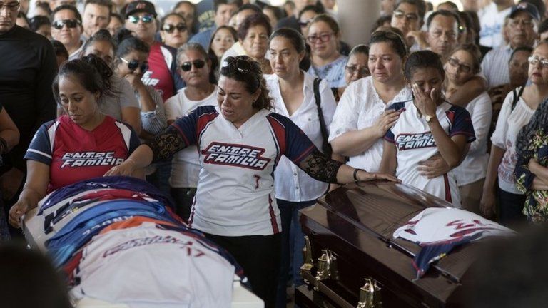 Relatives and friends of victims of an attack mourn during their funeral in Minatitlan, Veracruz State, Mexico, on April 21, 2019.
