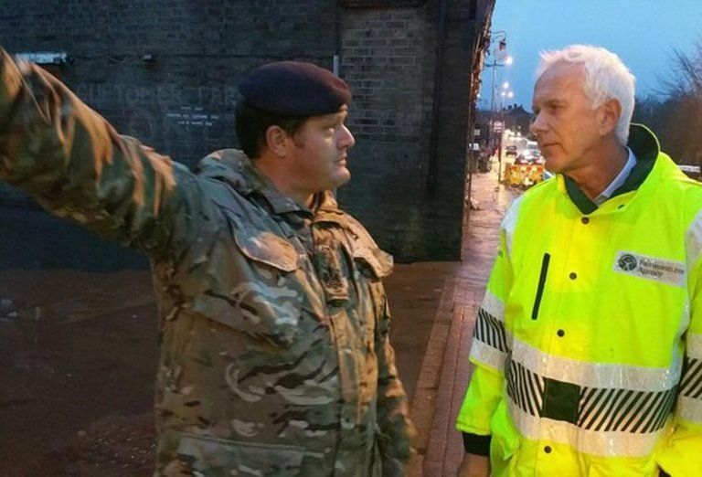 Handout photo taken from the Twitter feed of @EnvAgency of Environment Agency chairman Sir Philip Dilley (right) visiting flood-hit West Yorkshire
