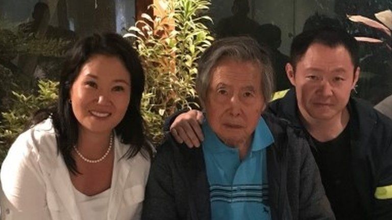 Keiko, Alberto and Kenji Fujimori pose for a photo in Lima