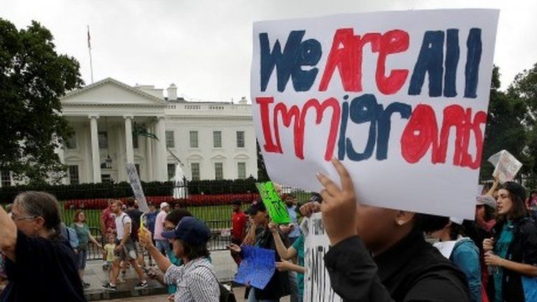 Demonstrators carrying signs supporting immigrants march during a rally by immigration activists CASA and United We Dream demanding the Trump administration protect the Deferred Action for Childhood Arrivals (DACA) program and the Temporary Protection Status (TPS) programs, in Washington, U.S., August 15, 2017.