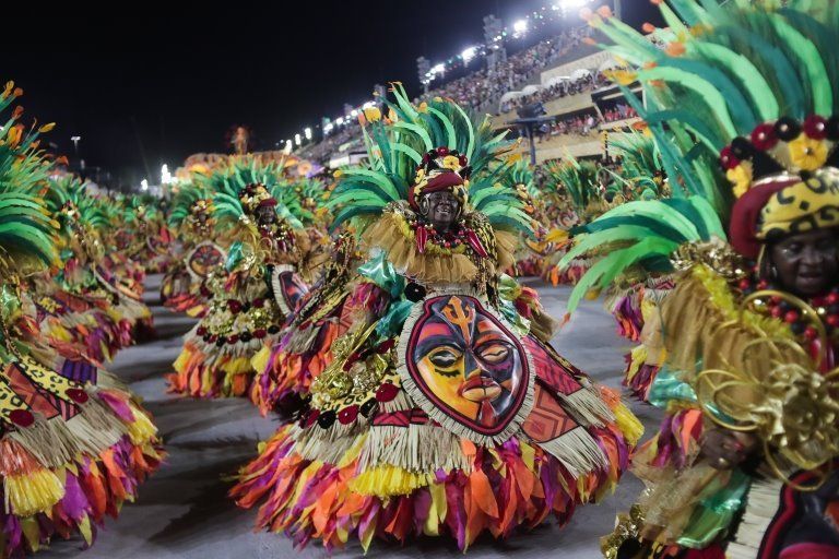 Members of the Grande Rio samba school perform during a carnival parade at the Sambadrome in Rio de Janeiro, Brazil, early 24 April 2022.