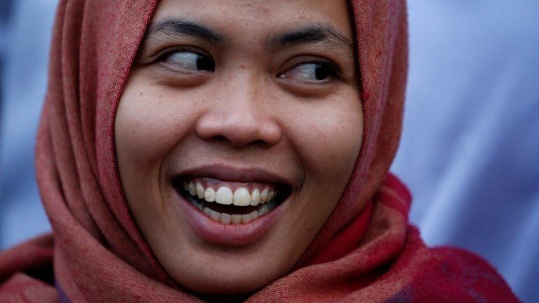 Siti Aisyah, who was previously a suspect in the murder case of North Korean leader's half brother Kim Jong Nam, laughs during a news conference