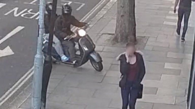 CCTV of moped riders following a victim carrying a mobile phone