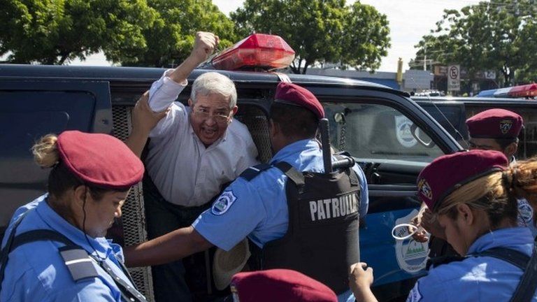 Police agents detain demonstrators participating in the "United for the Freedom" march, in Managua, Nicaragua, 14 October 2018