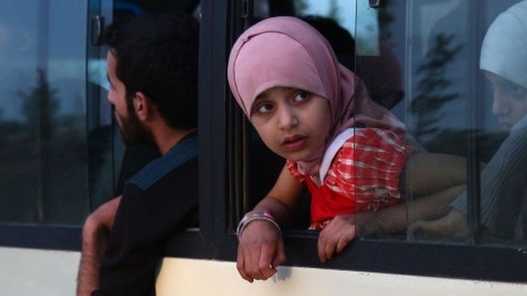 Girl looks out of window of bus from Douma (12/04/18)