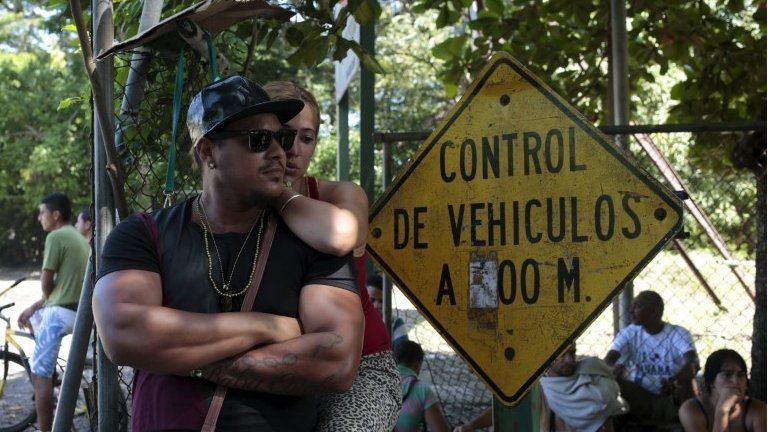 Cuban migrants take a break at the border between Costa Rica and Nicaragua in Penas Blancas on 17 November, 2015