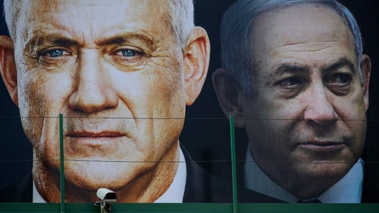 File photo shows election poster in Ramat Gan, Israel, featuring Benny Gantz (left) and Benjamin Netanyahu (right) (17 February 2020) AFP