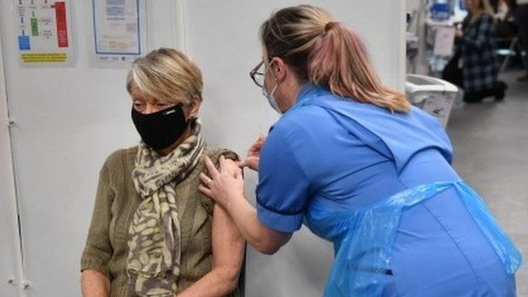 Rita Passey receives an injection of a Covid-19 vaccine in Birmingham