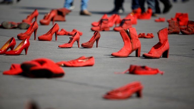 Pairs of women"' red shoes, put on display by Mexican visual artist Elina Chauvet to protest against gender violence and femicide, are pictured at Zocalo square in Mexico City, Mexico January 11, 20