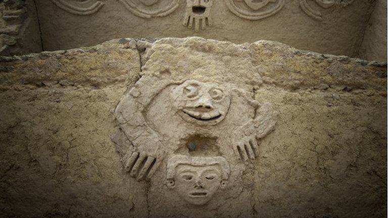 An undated handout photo made available by Archaeological Area Caral shows a humanized toad and an anthropomorphic head, discovered in one of the buildings of the civilization of Caral, north of Lima