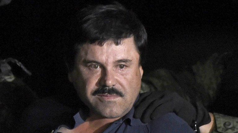 Joaquin "El Chapo" Guzman is escorted into a helicopter at Mexico City's airport on 8 January, 2016.