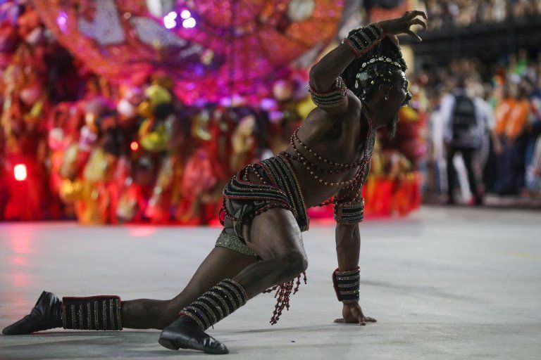 A member of the Grande Rio samba school performs during a carnival parade at the Sambadrome in Rio de Janeiro, Brazil, early 24 April 2022.