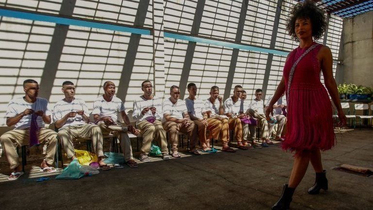 A model presents a creation as inmates crochet clothing as part of "Ponto Firme" project in the Adriano Marrey maximum security penitentiary in Guarulhos, Brazil on May 22, 2019