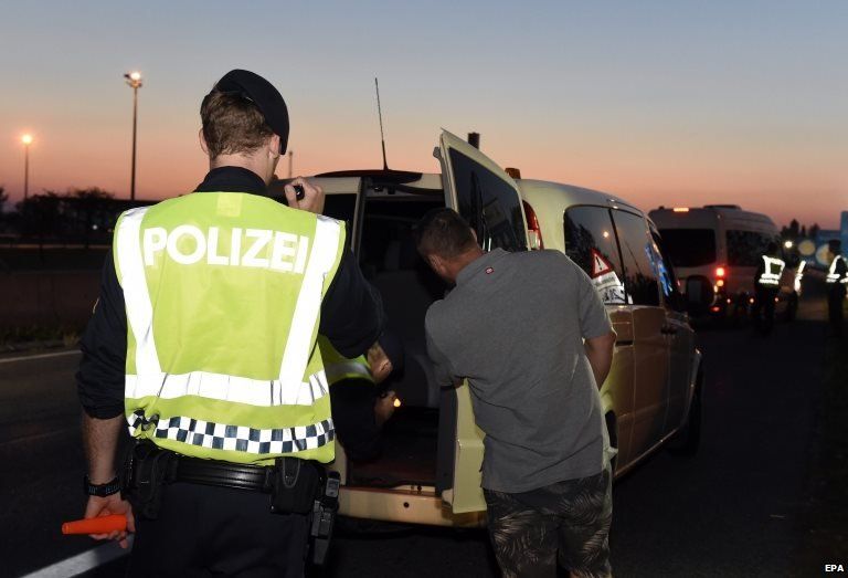 Austrian Police officers check a van on the motorway near the Austro-Hungarian border, in Nickelsdorf, Austria (30 August 2015)