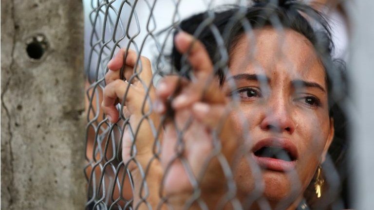 A relative of an inmate reacts in front of a prison complex in the Brazilian state of Amazonas after prisoners were found strangled to death in four separate jails, according to the penitentiary department in Manaus, Brazil May 27, 2019