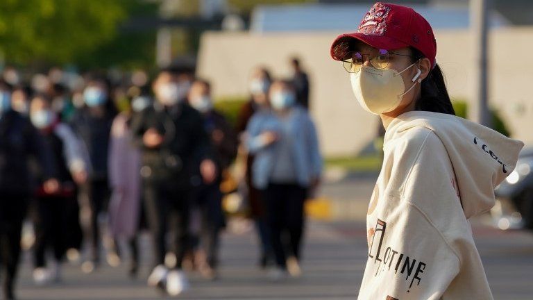Woman wearing mask in Beijing - 23 April