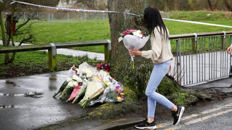 People lay floral tributes near to where 17-year-old Jodie Chesney was killed
