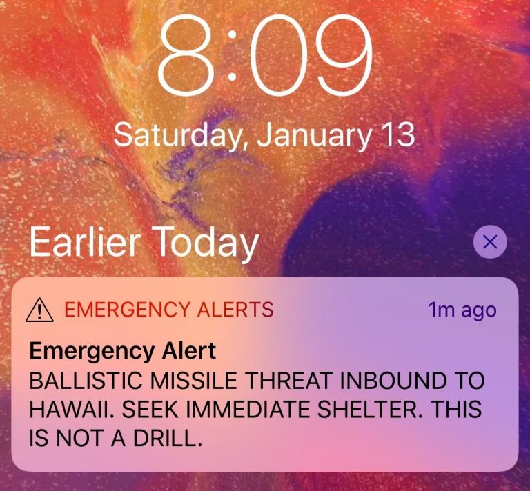 A screenshot from iphone shows warning message on iPhone screen