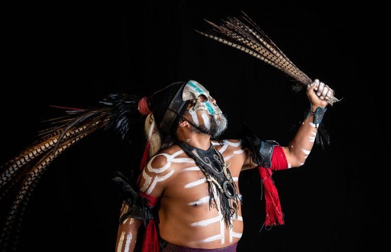 Mexican dancer Jorge de Jesus Trujillo, who represents "Mictlantecuhtli" (deity of the dead in the Mexica mythology) in the pre-Columbian ballgame Ulama poses for a photograph in Mexico City on 21 August, 2019.