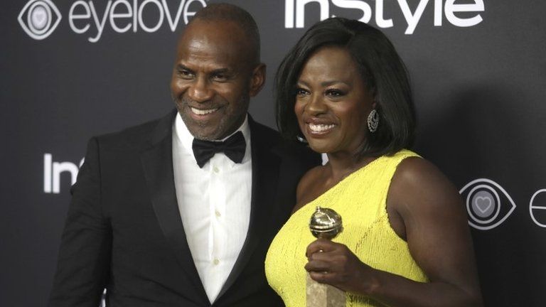 Actress Viola Davis, who won a Golden Globe Award for Best Supporting Actress in the film "Fences" with husband Julius Tennon.