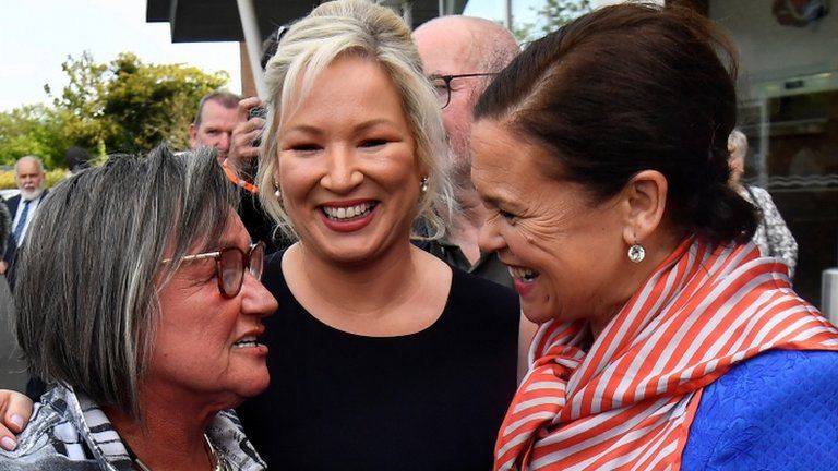 Sinn Féin deputy leader Michelle O'Neill pictured with a supporter, who is also talking to Mary Lou McDonald