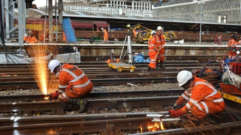 Railway workers completing engineering work