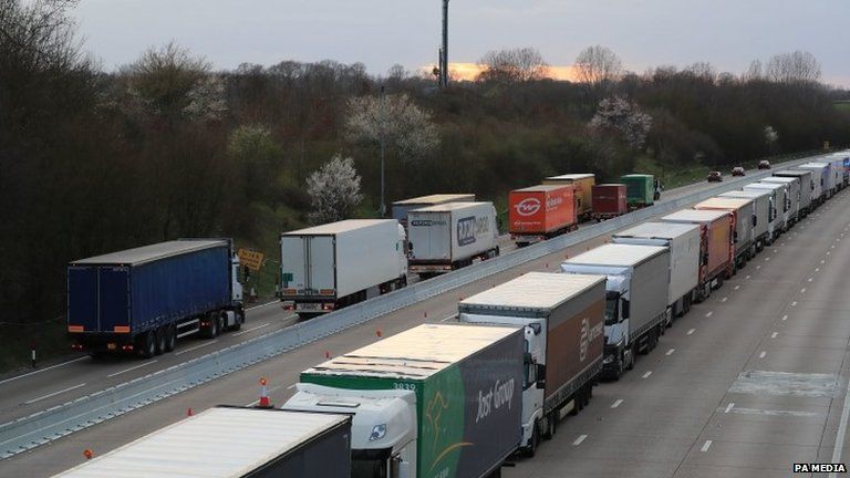Lorries queue on the A20 outside Dover in Kent where Operation Stack is being implemented