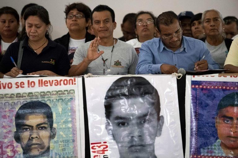 Relatives of some of the 43 missing students of Ayotzinapa, offer a press conference after meeting with Mexican President Andres Manuel Lopez Obrador, in Mexico City, on September 11, 2019