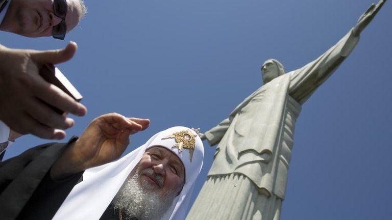 Russian Orthodox Church Patriarch Kirill gives his blessing after a religious service in front of the Christ the Redeemer statue
