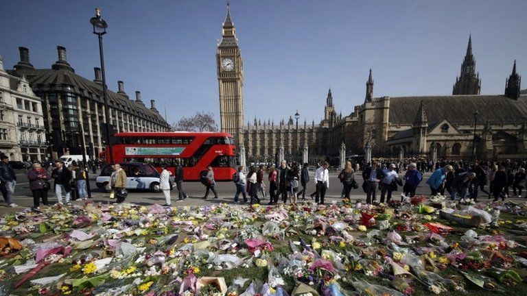 Floral tributes to the victims of the Westminster attack are placed outside the Palace of Westminster, London, Monday March 27, 2017
