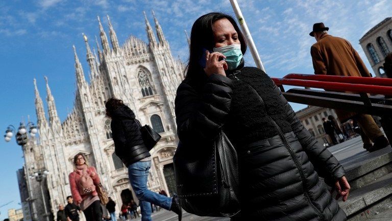 Woman outside Milan cathedral