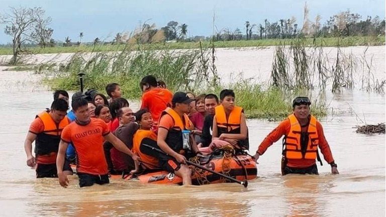 A Philippine Coast Guard handout photo of emergency services rescuing people after Typhoon Rai