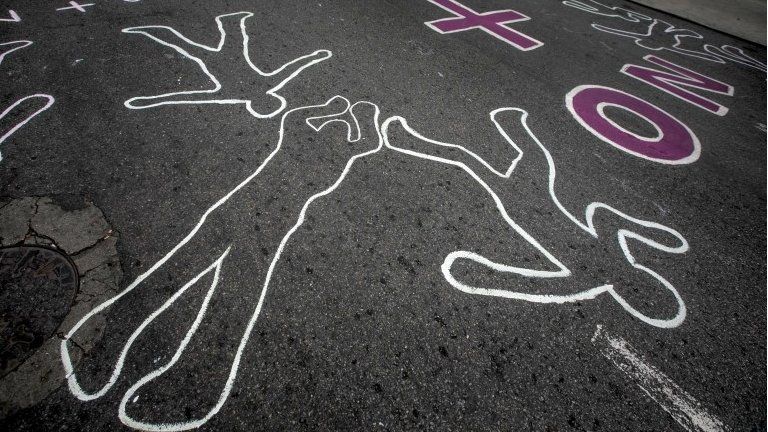 Outlines of the human body and victims" names of the two-month long protests are painted on a street in of Los Palos Grandes, east of Caracas, Venezuela, 04 June 2017.