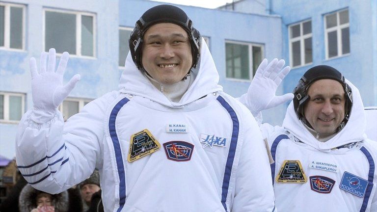 Members of the International Space Station expedition 54/55 Norishige Kanai (L) of the Japan Aerospace Exploration Agency (JAXA) and Roscosmos cosmonaut Anton Shkaplerov (R) during the send-off ceremony after checking their space suits before the launch of the Soyuz MS-07 spacecraft at the Baikonur cosmodrome, in Kazakhstan on 17 December 2017
