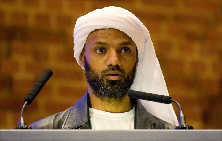A file photo taken on August 30, 2009, shows former Guantanamo Bay prisoner Binyam Mohamed speaking publicly for the first time since his release at a fundraising dinner event "Beyond Guantanamo" in west London.