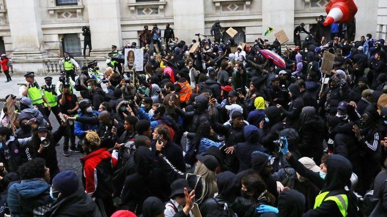 Anti-racism protesters and police in London