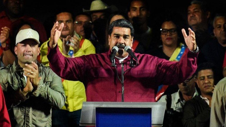 Venezuelan President Nicolas Maduro addresses supporters after the National Electoral Council (CNE) announced the results of the voting on election day in Venezuela, on May 20, 2018 in Caracas