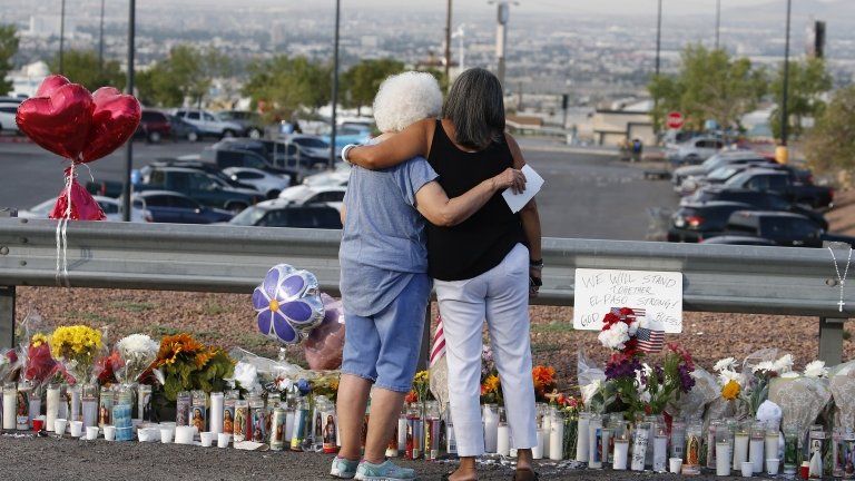 Mourners in El Paso Texas after a shooting there which killed 22 people