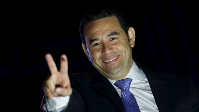 Guatemala's President-elect Jimmy Morales gestures to supporters after winning the presidential elections in Guatemala City on 26 October, 2015