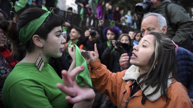 A pro-choice activist (L) argues with a woman opposed to the legalization of abortion outside the Argentine Congress in Buenos Aires, on June 13, 2018.